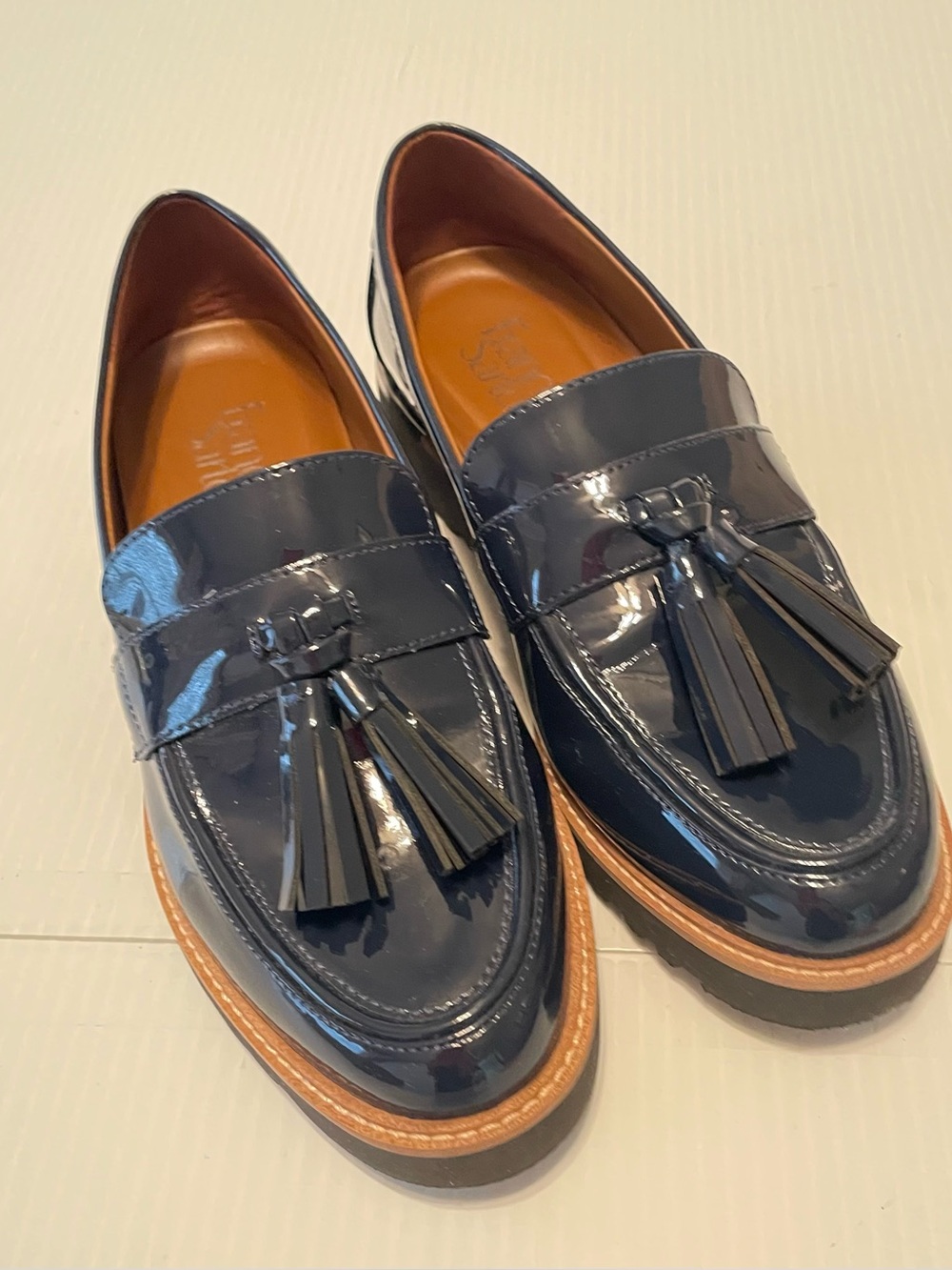 Navy patent tassel loafers